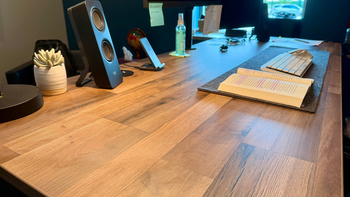 Uplift V3 standing desk with bamboo top in home office