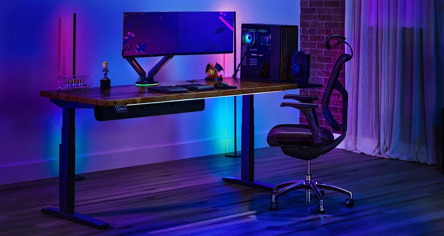 Uplift V3 standing desk — full view with accessories and dual monitor setup